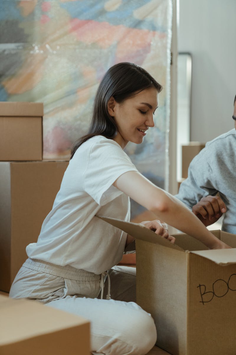 renter, Woman in White Long Sleeve Shirt and Gray Pants Holding Brown Wooden Stick